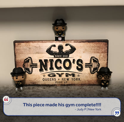 Gym Sign V canvas by Tailored Canvases with three small figurines around a vintage sign on Tampa Home & Garden Store