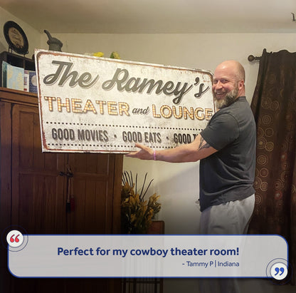 Family Theater and Lounge IV Sign canvas display held by a man on Tampa Home & Garden Store