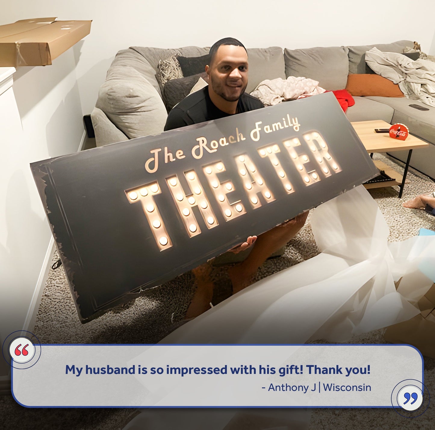 Theater Sign canvas in black with lit marquee bulbs, held by a man on a gray sofa on Tampa Home & Garden Store