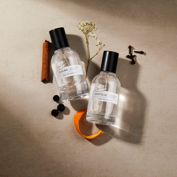 Eau de Parfum set Flaura + Santelle by UpCircle, two clear glass perfume bottles with black caps on Tampa Home & Garden Store