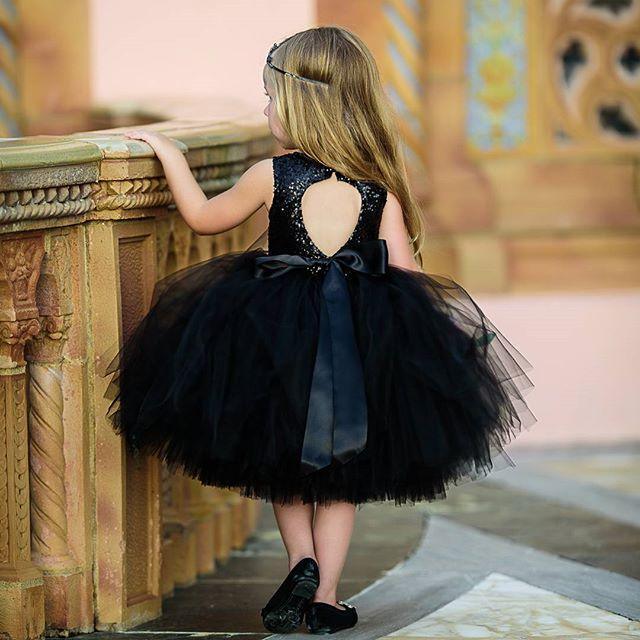 Baby girl sleeveless sequin dress with black tutu skirt, bow at waist and back heart cutout on Tampa Home & Garden Store