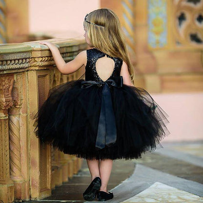 Baby girl sleeveless sequin dress with black tutu skirt, bow at waist and back heart cutout on Tampa Home & Garden Store
