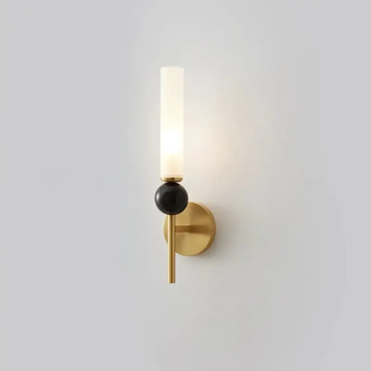Modern brass wall sconce with frosted glass shade and black accent for foyer hallway on Tampa Home & Garden Store