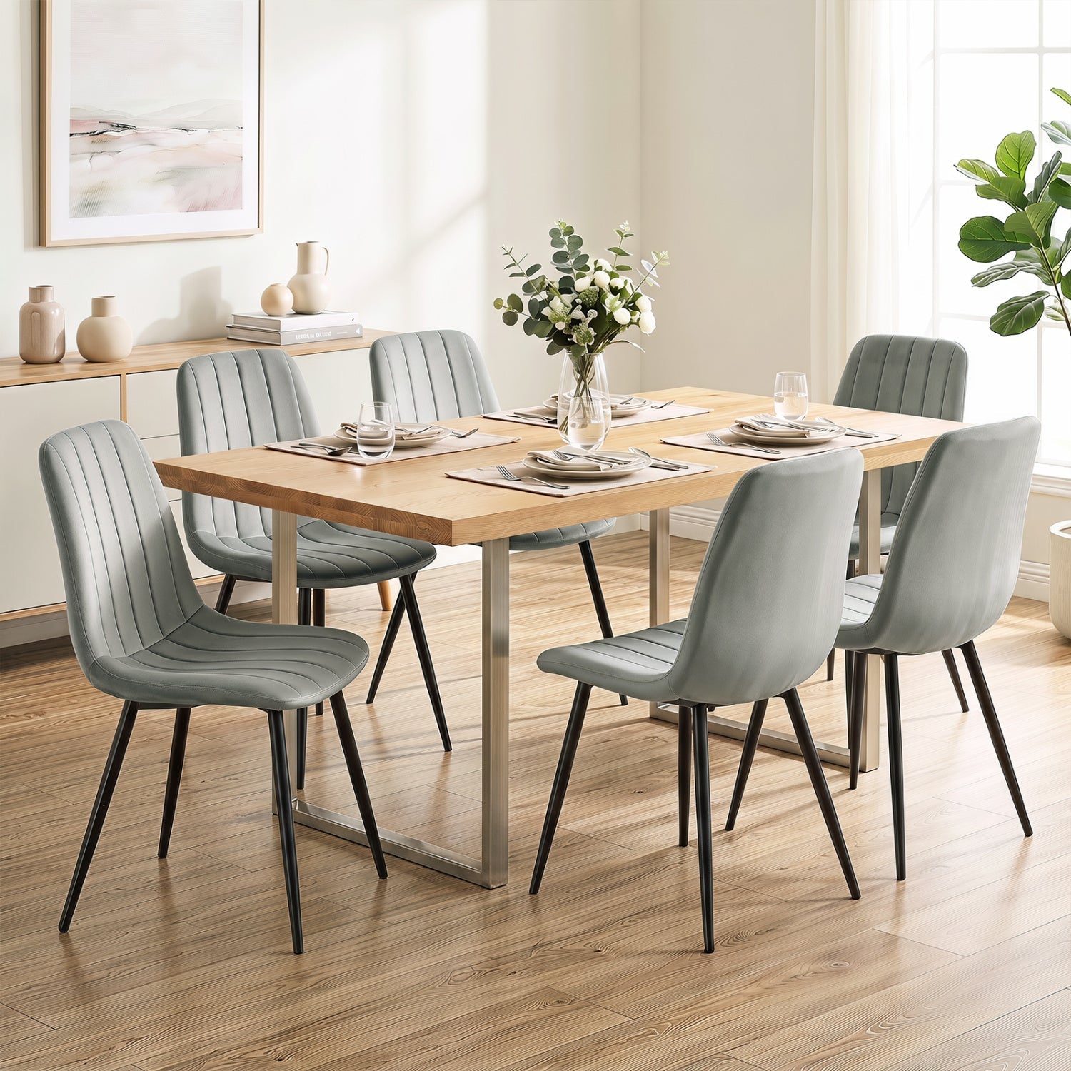 Upholstered dining chairs set of 4 with metal legs in light gray fabric around a wooden dining table on Tampa Home & Garden Store