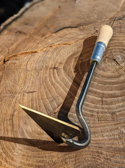 Scuffle weeder with a wooden handle and curved steel head by Homestead Iron, LLC on Tampa Home & Garden Store