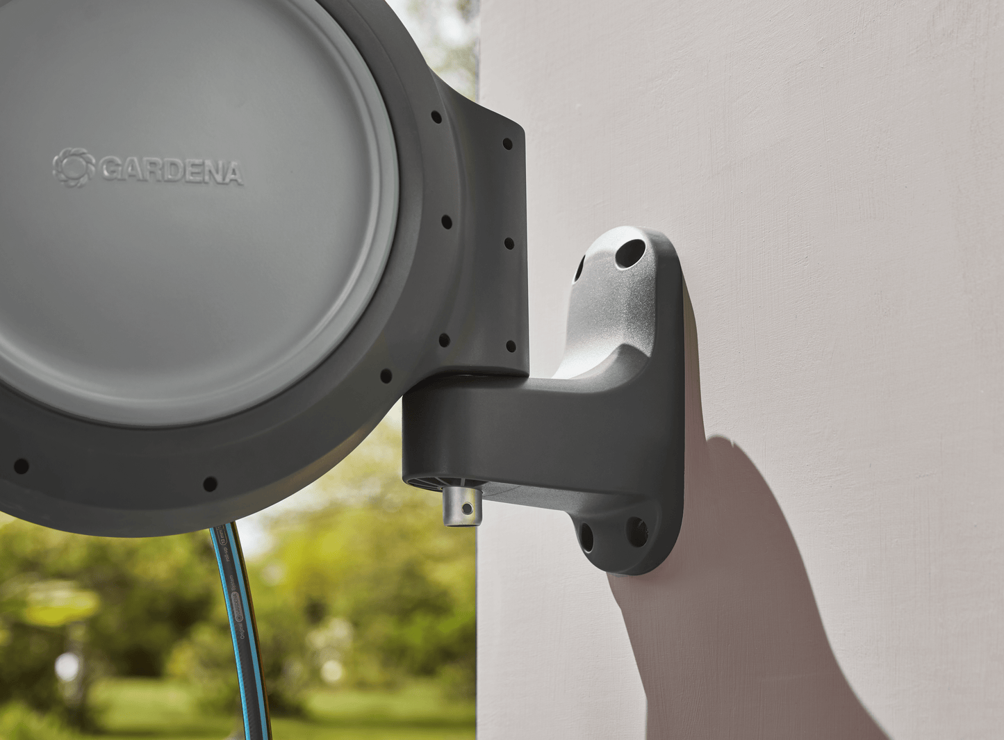 Retractable Hose Reel RollUp 50 ft by Gardena, wall-mounted gray housing on Tampa Home & Garden Store