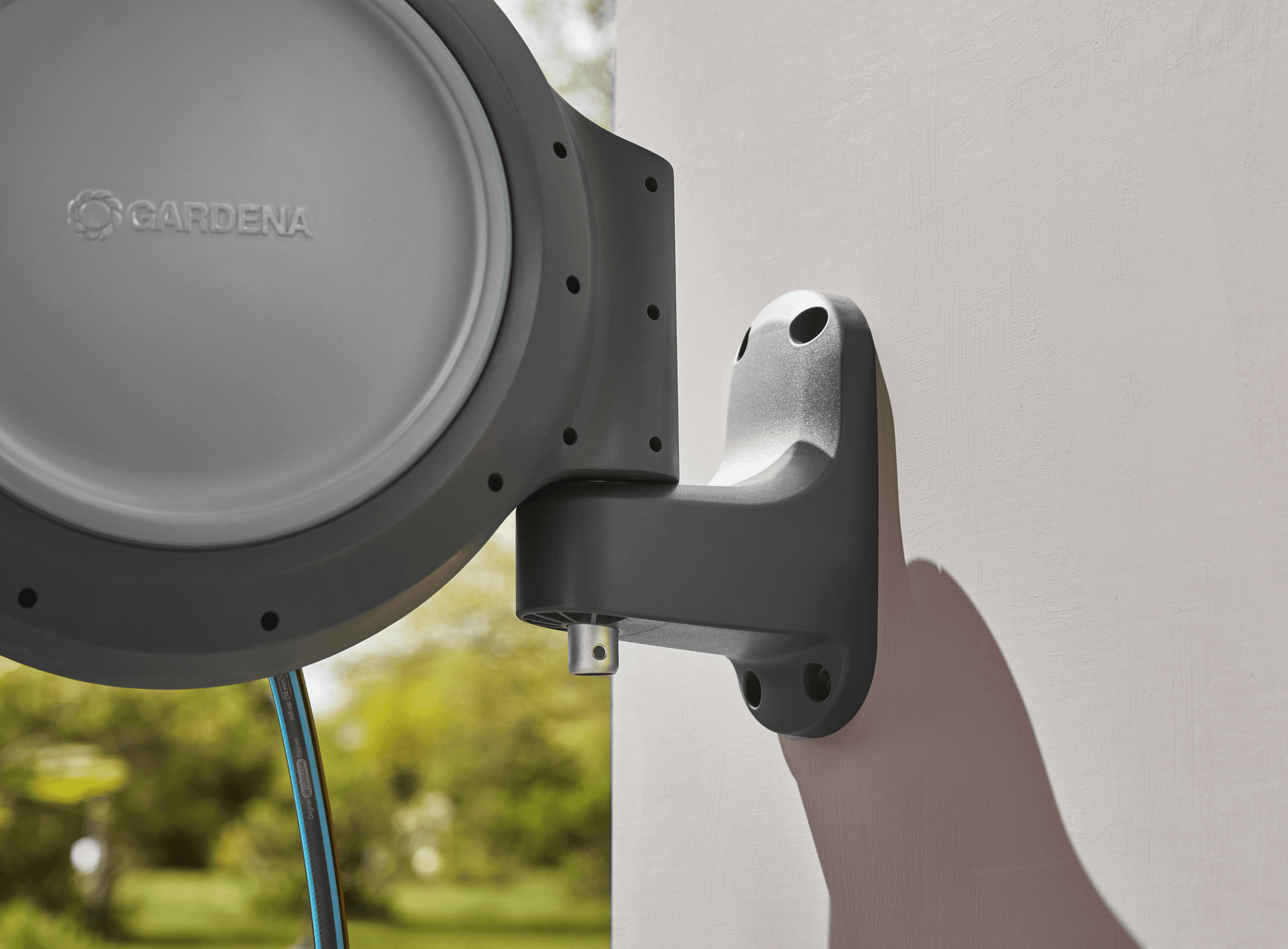 Retractable Hose Reel RollUp 50 ft by Gardena, wall-mounted gray housing on Tampa Home & Garden Store