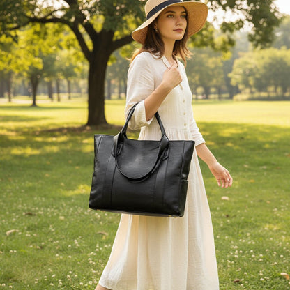 Retro Leather Shoulder Tote Bag Moktan Sabai in black leather with top handles carried by woman on Tampa Home & Garden Store