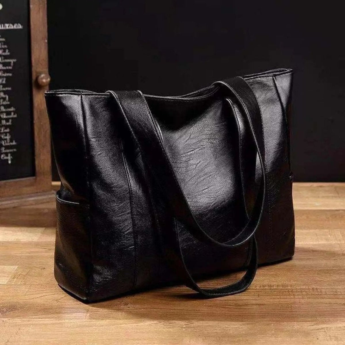 Black retro leather shoulder tote bag by Moktan Sabai with dual top handles on Tampa Home & Garden Store