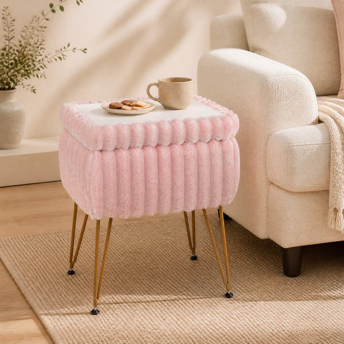 Vanity stool with storage pink plush upholstery, white lid, gold legs beside beige sofa on Tampa Home & Garden Store