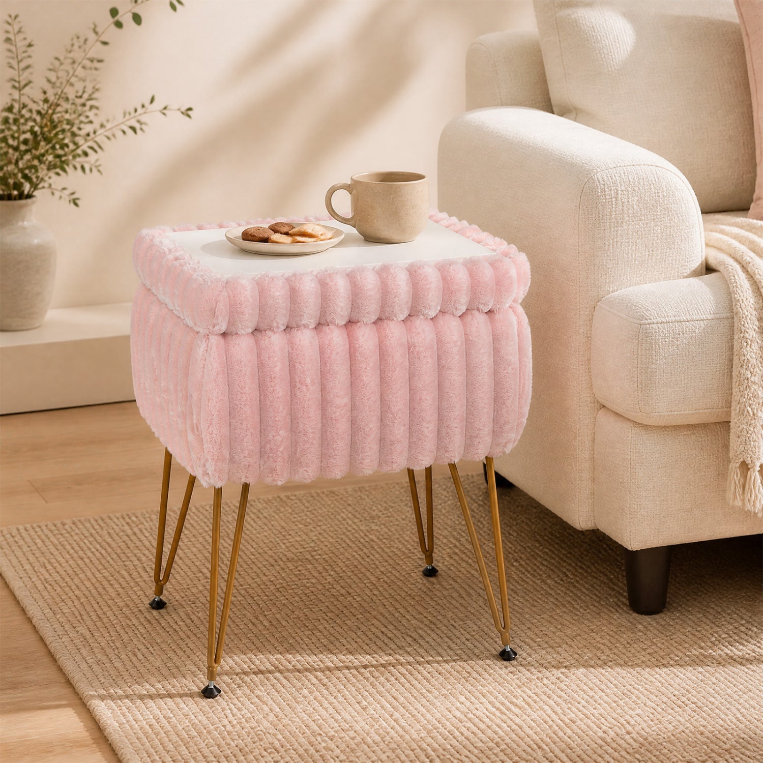 Vanity stool with storage pink plush upholstery, white lid, gold legs beside beige sofa on Tampa Home & Garden Store