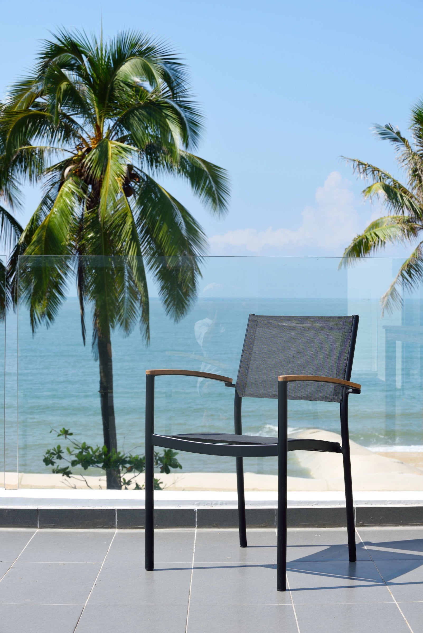 Rinjani rectangular patio dining set with 4 Vera stacking armchairs, dark frames, grey seats on Tampa Home & Garden Store