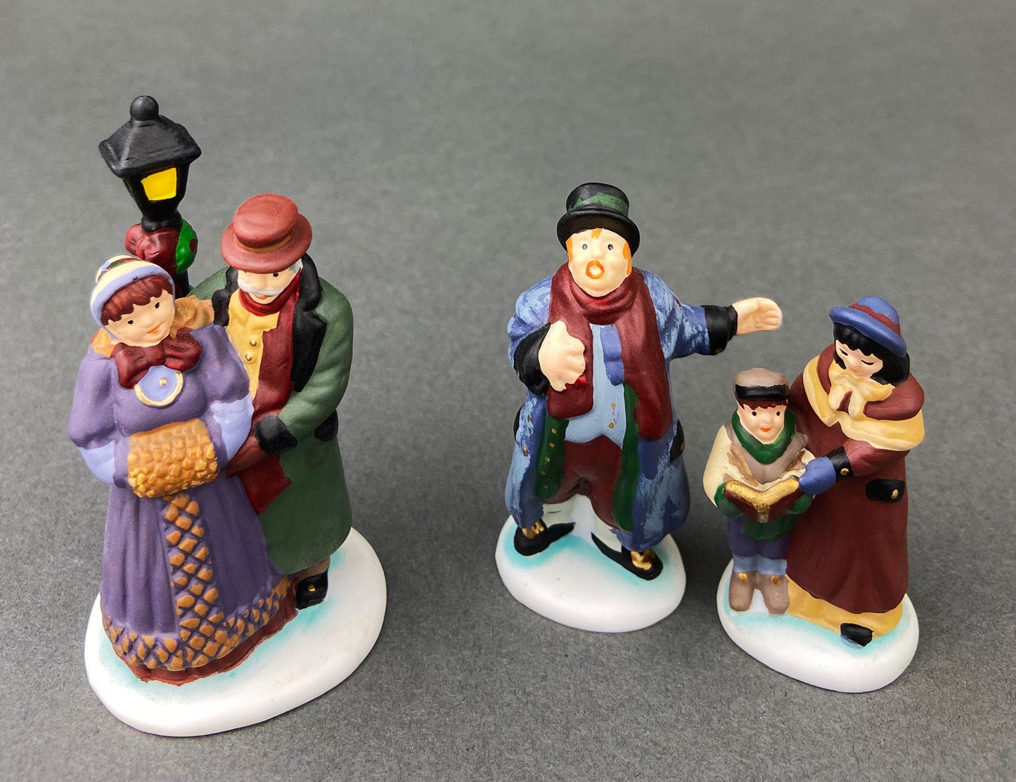 Village Accessories by Department 56.  Town Square Carolers.  Handpainted Set of Three Porcelain Figurines.  Heritage Village Collection. - Tampa Home & Garden Store