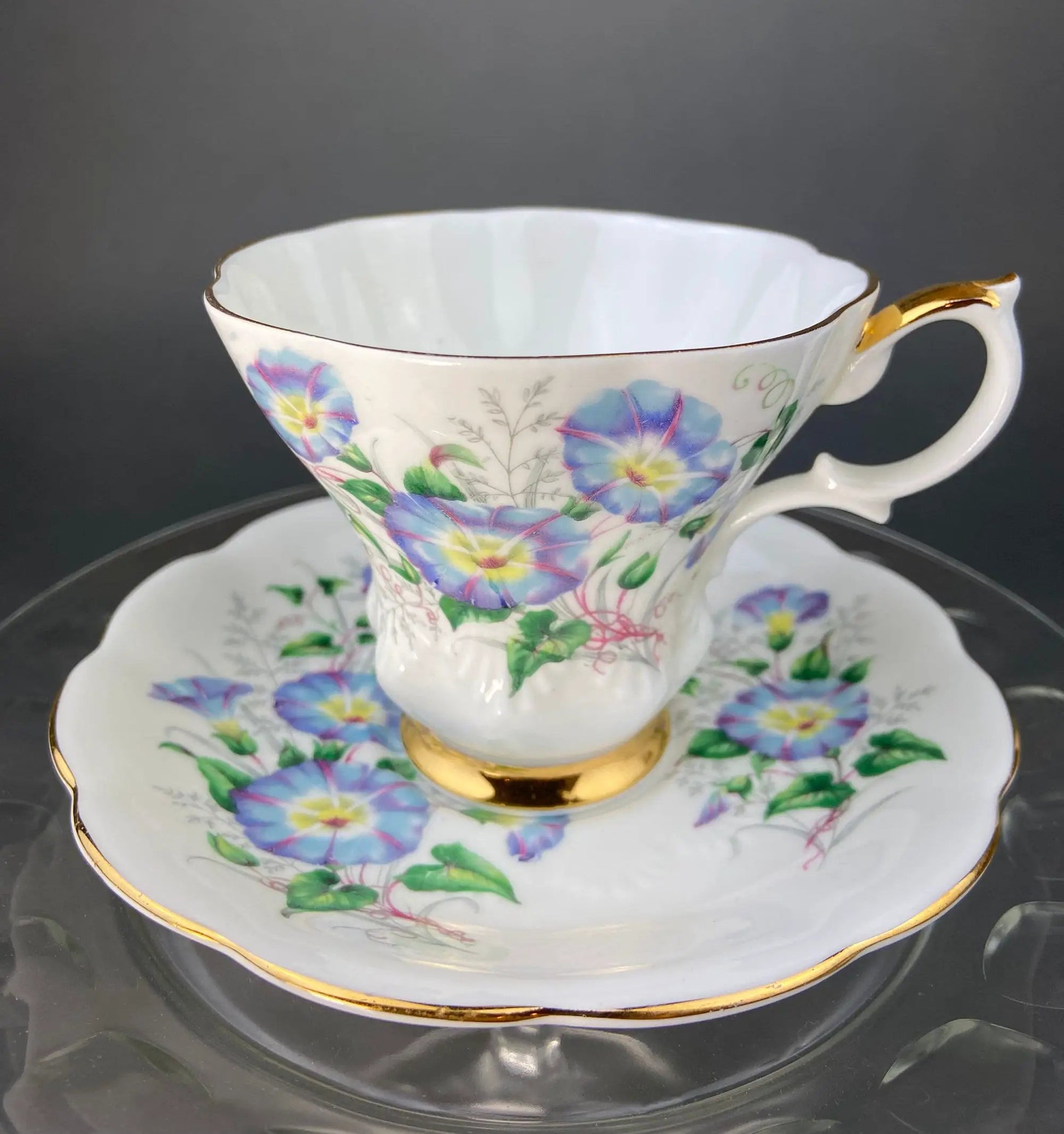 Vintage teacup and saucer set with Forget-Me-Not floral pattern, white porcelain with gold trim on Tampa Home & Garden Store