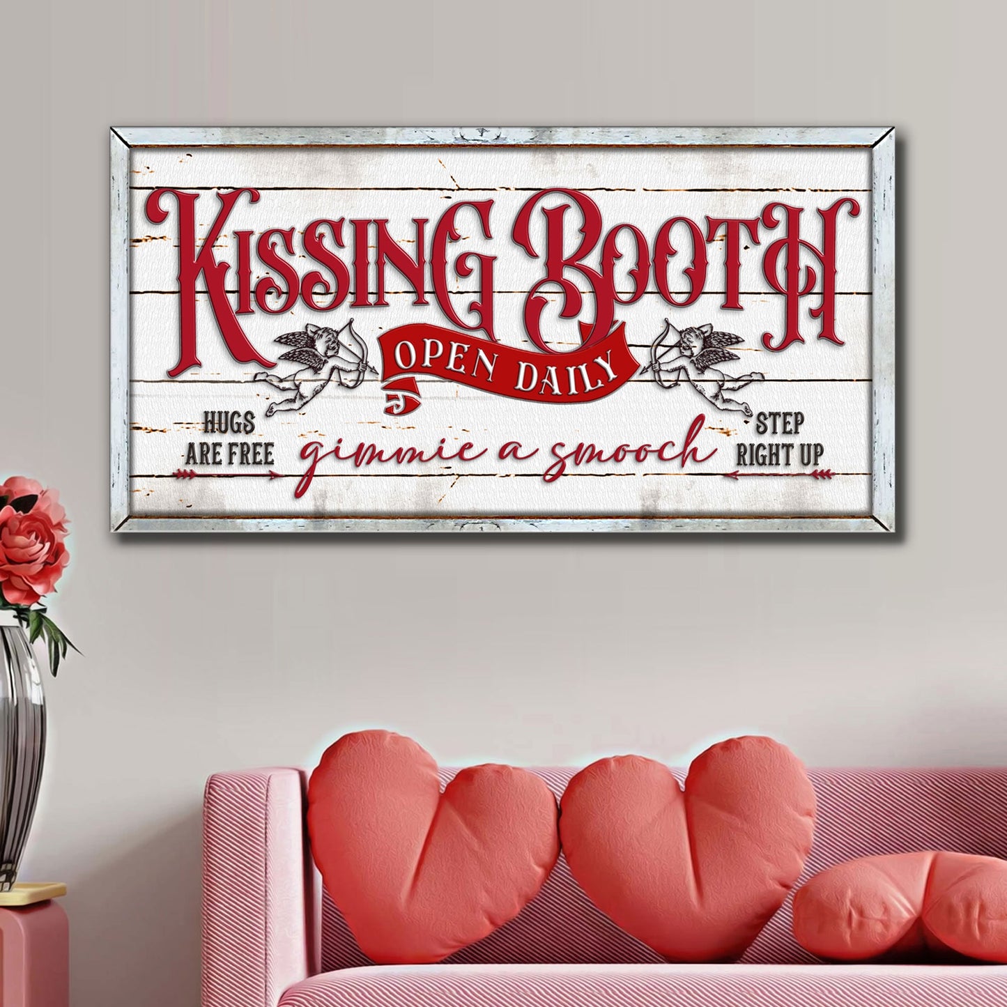 Kissing Booth canvas sign with red ornate lettering on distressed white wood backdrop framed on Tampa Home & Garden Store