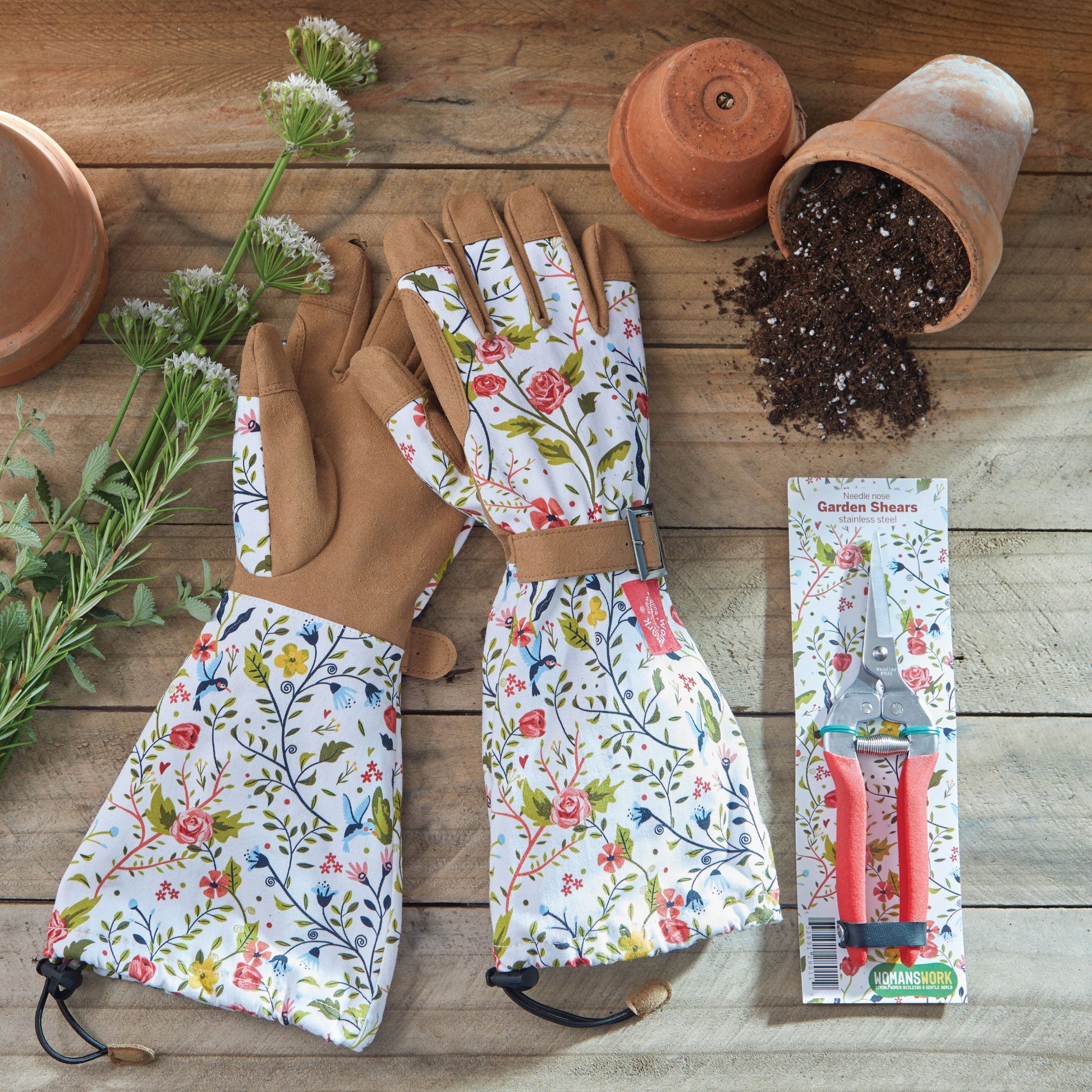 Compact pruning shears by Womanswork with pink handles, floral gloves and terracotta pots on Tampa Home & Garden Store