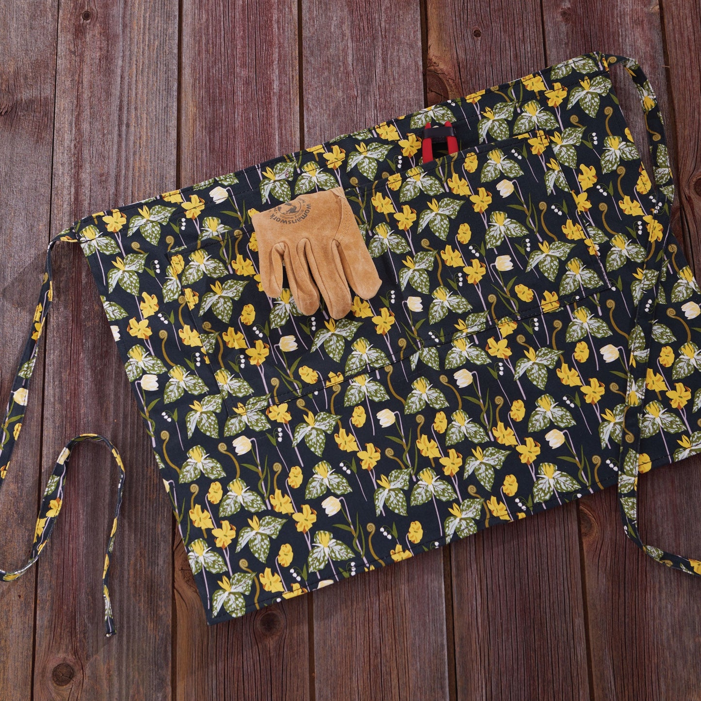 Gardener's Half Apron by Womanswork in navy floral fabric with yellow flowers on Tampa Home & Garden Store