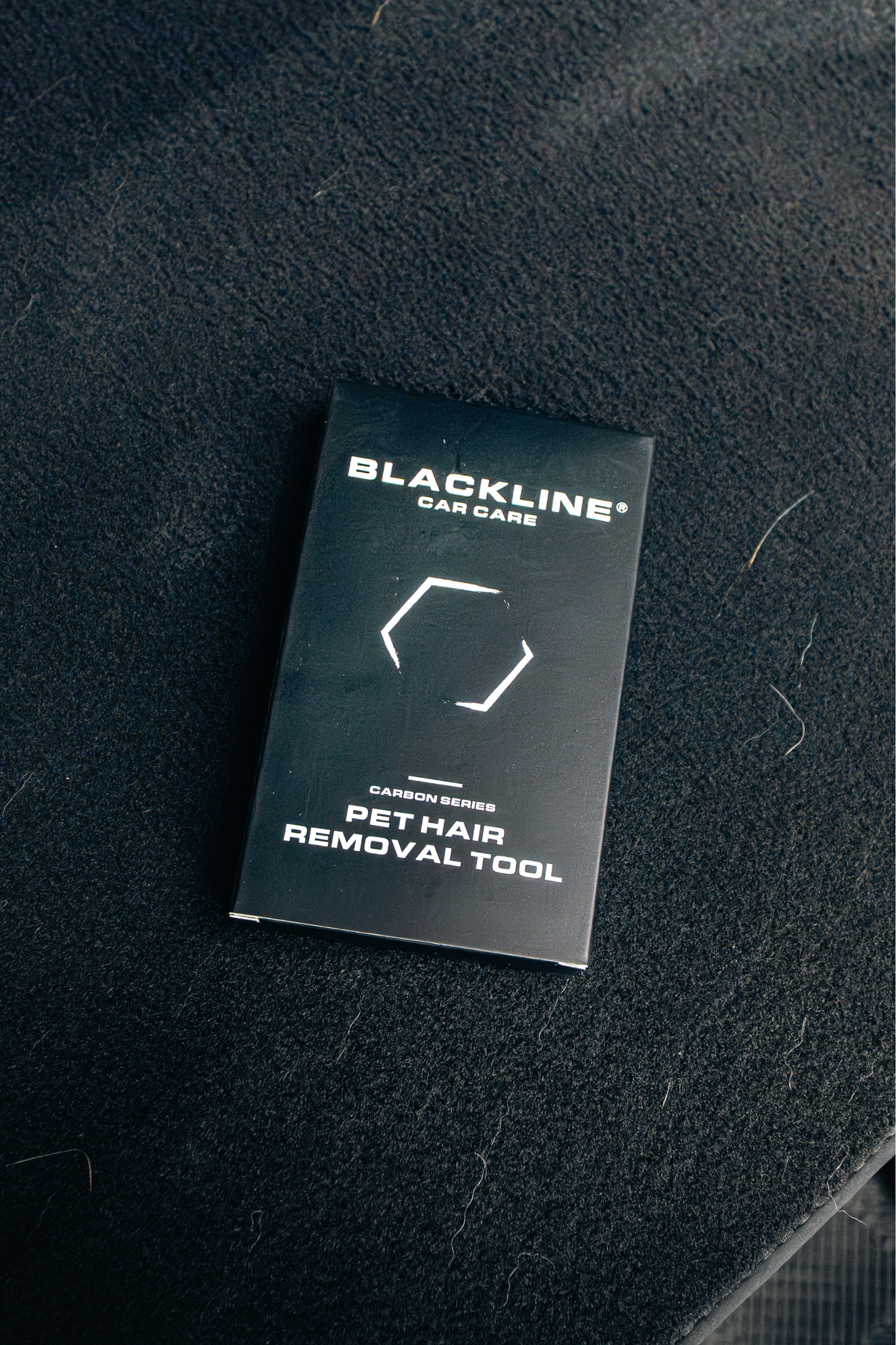 BLACKLINE PET HAIR BRUSH packaging box on dark carpet with Blackline Car Care logo on Tampa Home & Garden Store