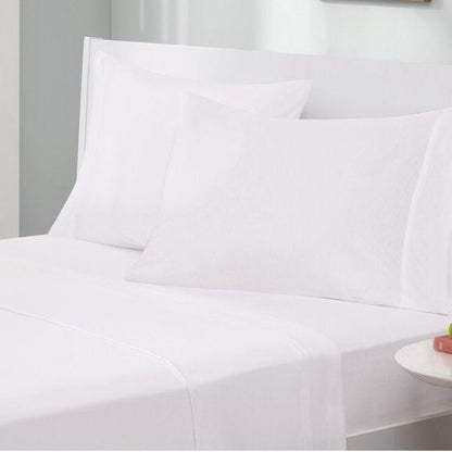Twin XL jersey sheet set by HomePacific, 4-piece cotton blend in white on a neatly made bed on Tampa Home & Garden Store