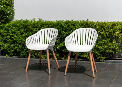 Leyland Table and Nassau White Armchairs Dining Set white armchairs with wooden legs on patio on Tampa Home & Garden Store