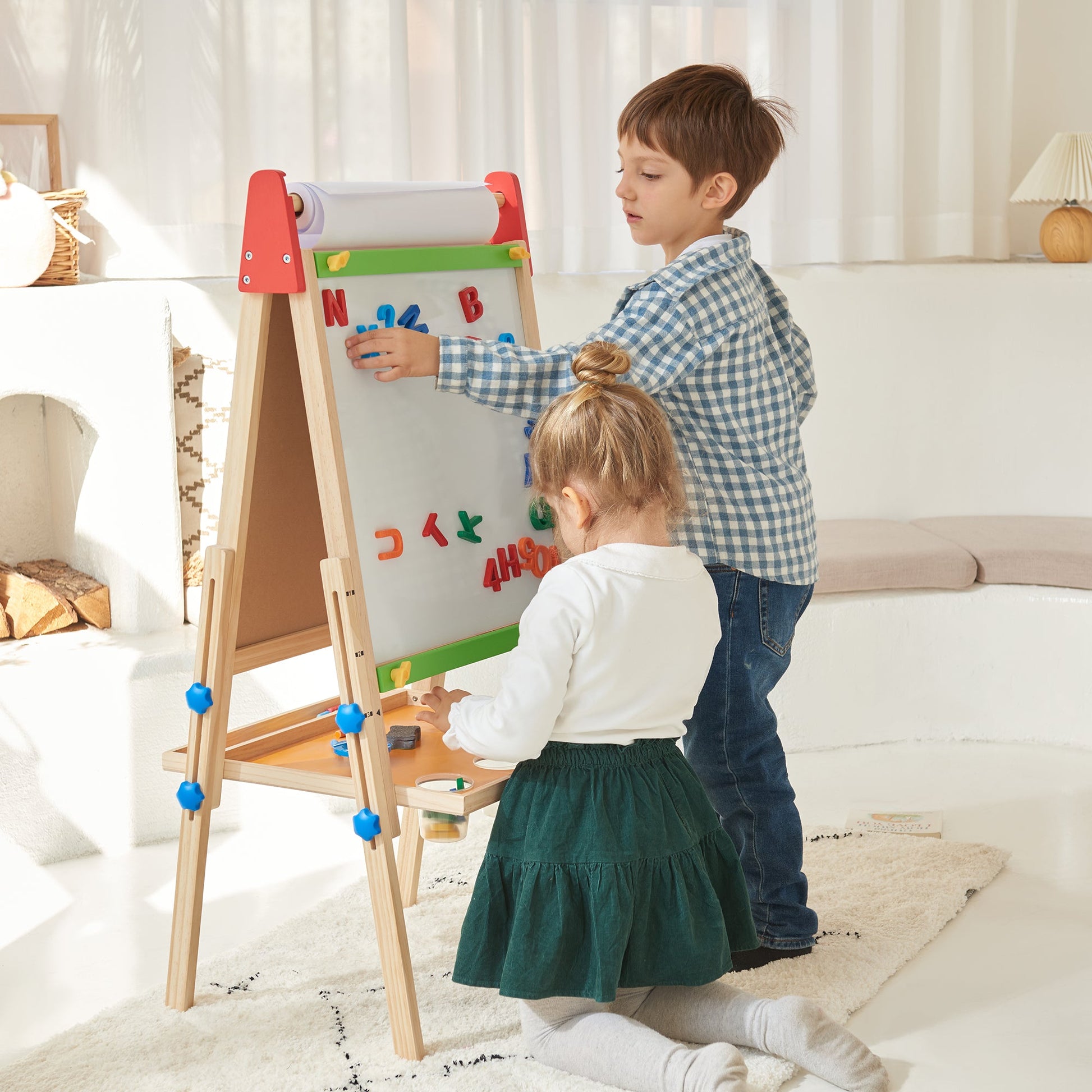 Tiny Land 3-in-1 Kids Easel wooden A-frame with paper roll; magnetic letters, two kids at it on Tampa Home & Garden Store