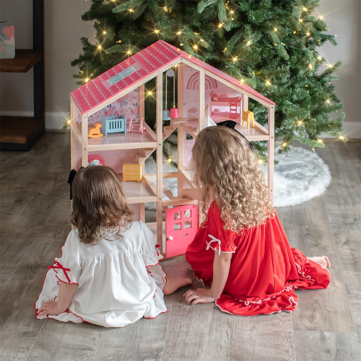 Tiny Land Sweetwood Dollhouse without Dolls, pink wooden two-story dollhouse on display on Tampa Home & Garden Store