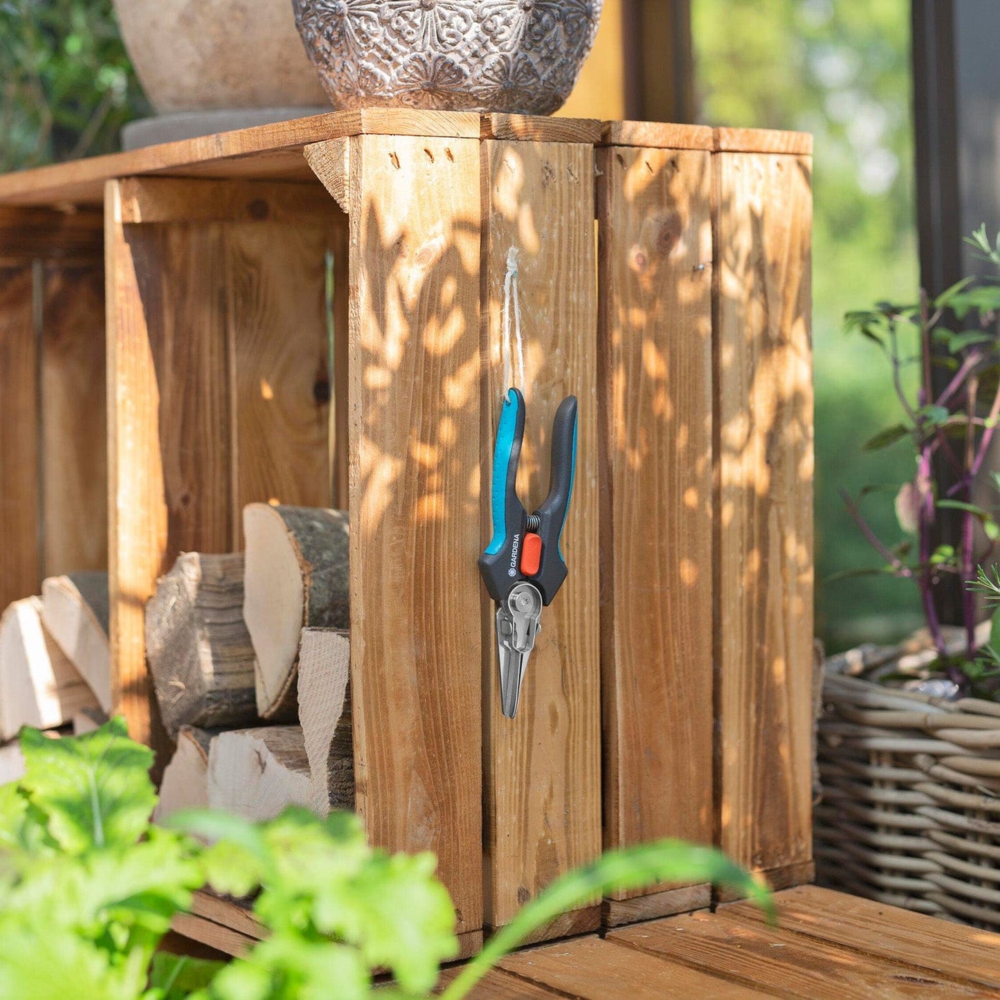 GripCut Scissors Gardena pruning shears with blue and black handles hanging on a wooden post on Tampa Home & Garden Store