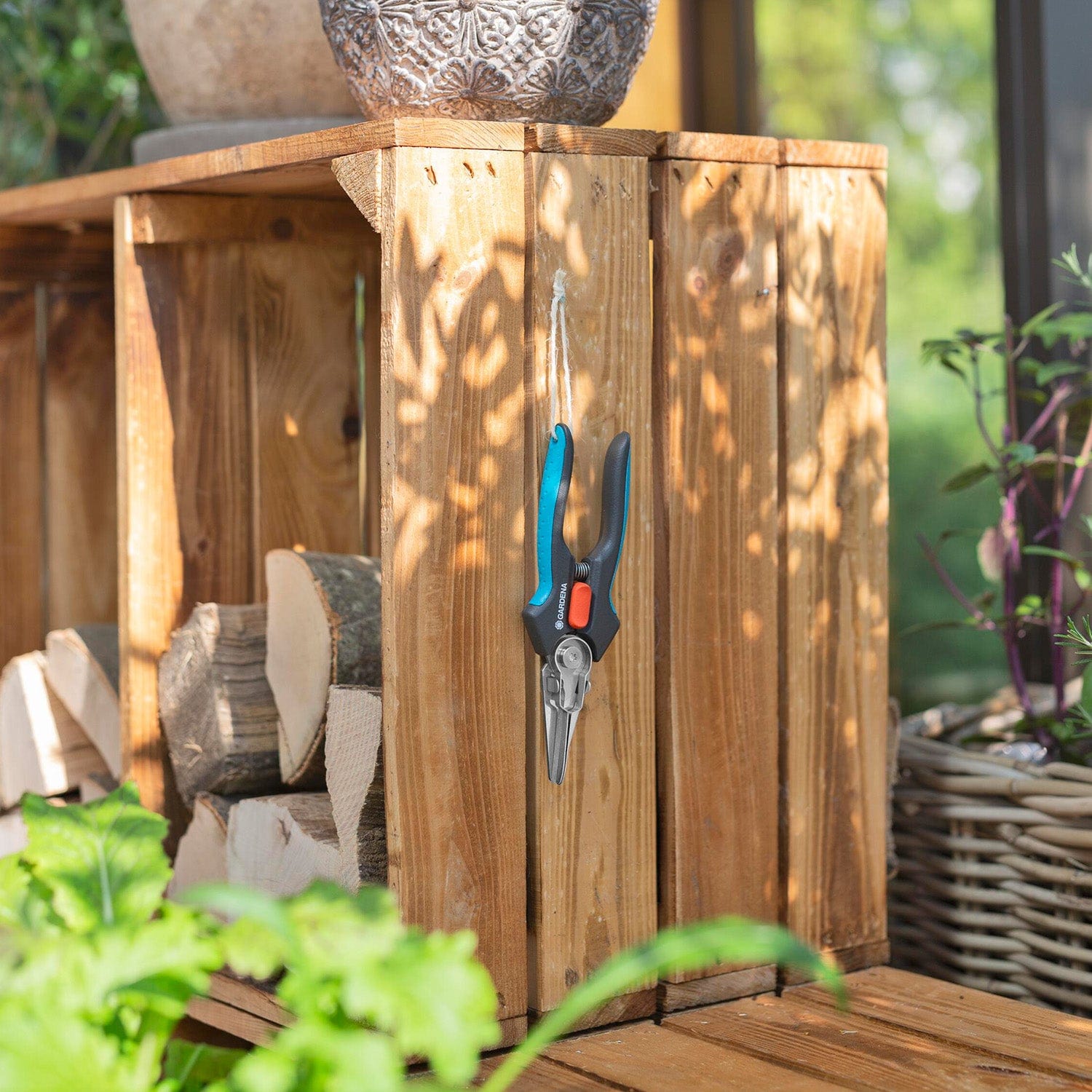 GripCut Scissors Gardena pruning shears with blue and black handles hanging on a wooden post on Tampa Home & Garden Store