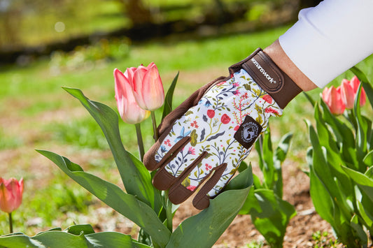 Digger Gardening Gloves by Womanswork, floral fabric with brown leather trim in a tulip garden on Tampa Home & Garden Store