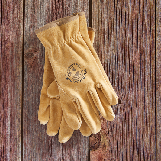 The Original Leather Work Glove by Womanswork tan suede gardening gloves on rustic wood surface on Tampa Home & Garden Store