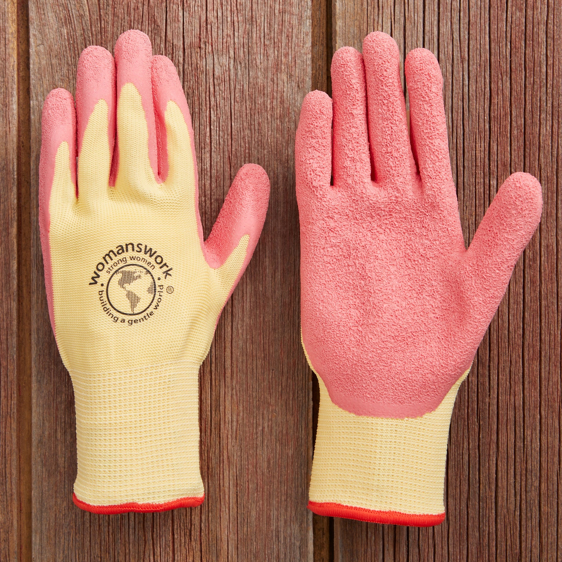 The Weeder Glove pair by Womanswork, yellow and pink gardening gloves with textured palms on a wooden surface on Tampa Home & Garden Store