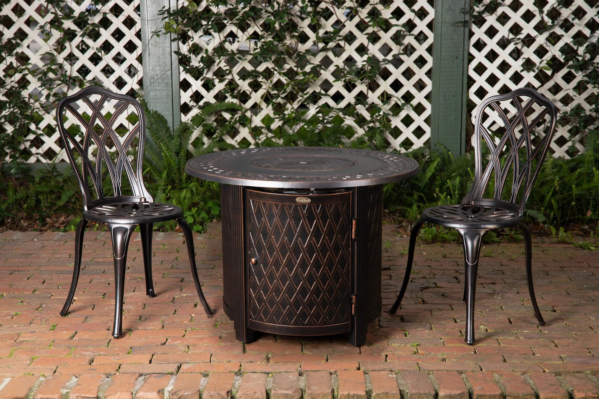 Wagner 33 inch Round Aluminum LPG Fire Pit bronze by Fire Sense gas pit with two chairs on Tampa Home & Garden Store