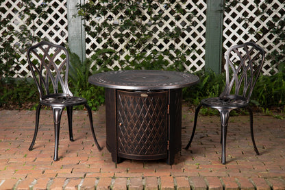 Wagner 33 inch Round Aluminum LPG Fire Pit bronze by Fire Sense gas pit with two chairs on Tampa Home & Garden Store