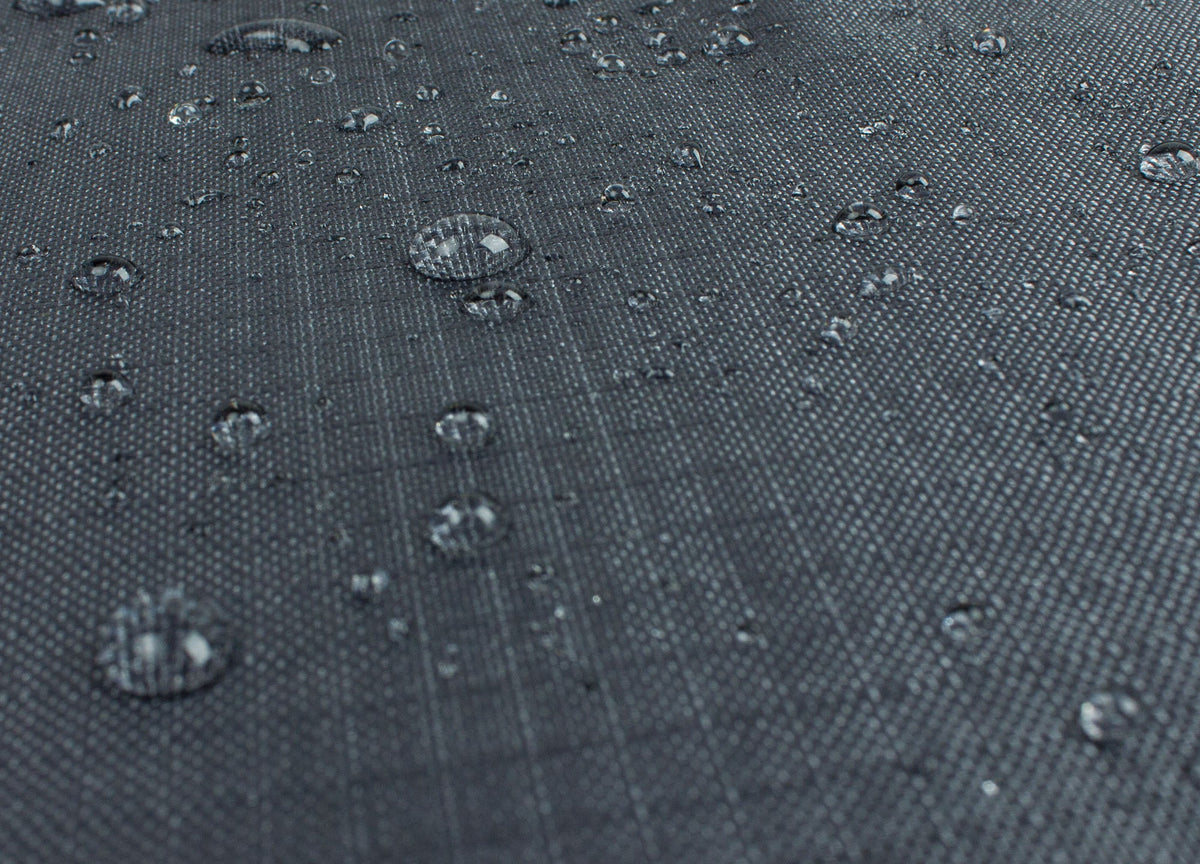Shield Outdoor Covers Mercury dining table chair cover close-up fabric with water droplets on Tampa Home & Garden Store