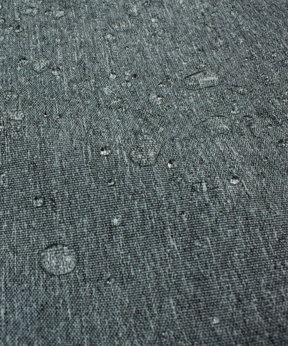 Chair cover fabric in dark gray denim texture with water droplets on Tampa Home & Garden Store