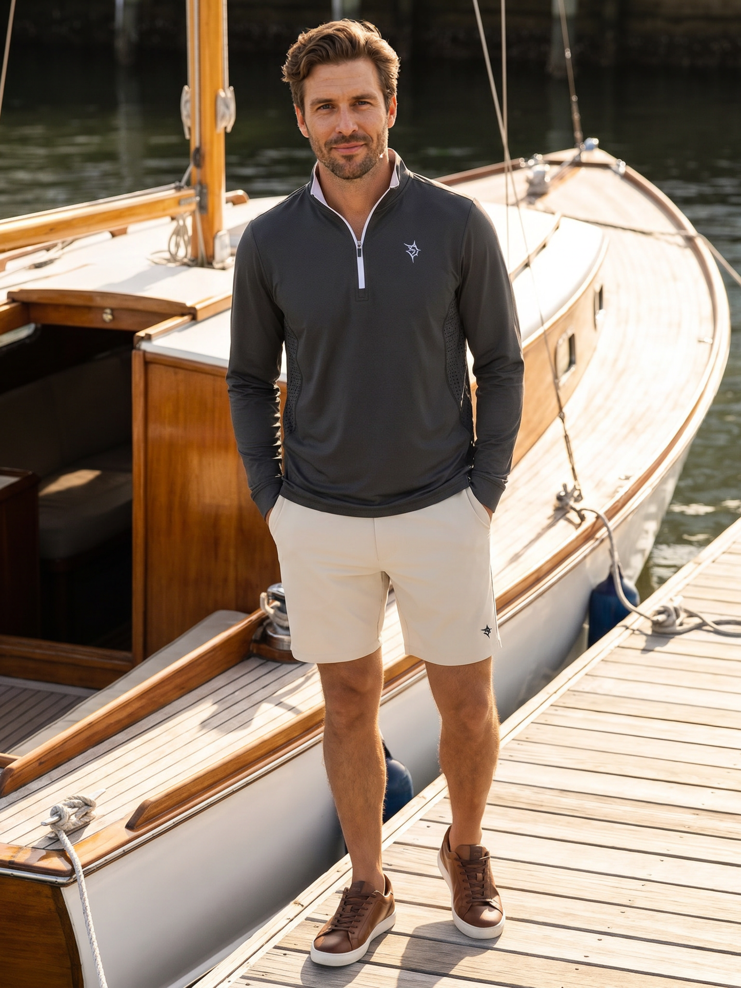 Monterey Performance Quarter Zip gray long-sleeve with White Water Life branding on dock on Tampa Home & Garden Store