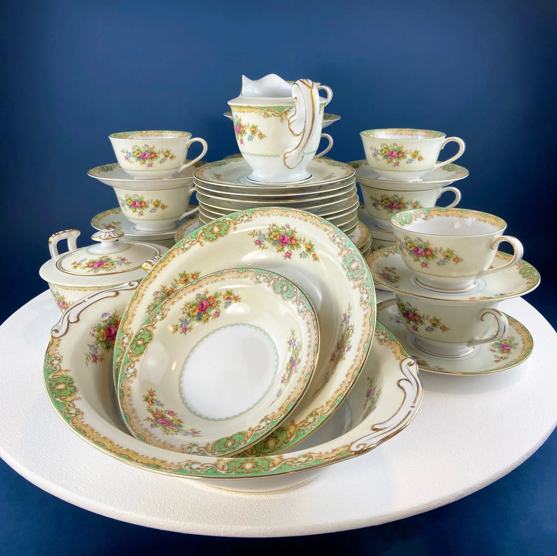Wedgewood Cavendish 20-piece dinnerware set with floral cups, saucers and plates green-gold trim on Tampa Home & Garden Store
