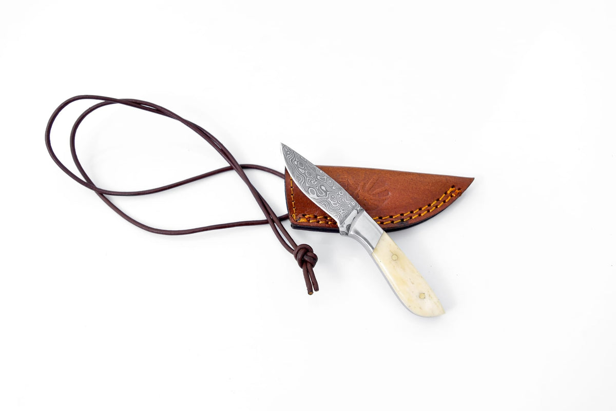 Neck knife TK-093 by Titan Int'l K; ivory handle, damascus blade, brown leather sheath on Tampa Home & Garden Store
