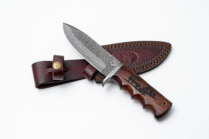 Damascus steel hunting knife with engraved walnut scales and leather sheath on Tampa Home & Garden Store