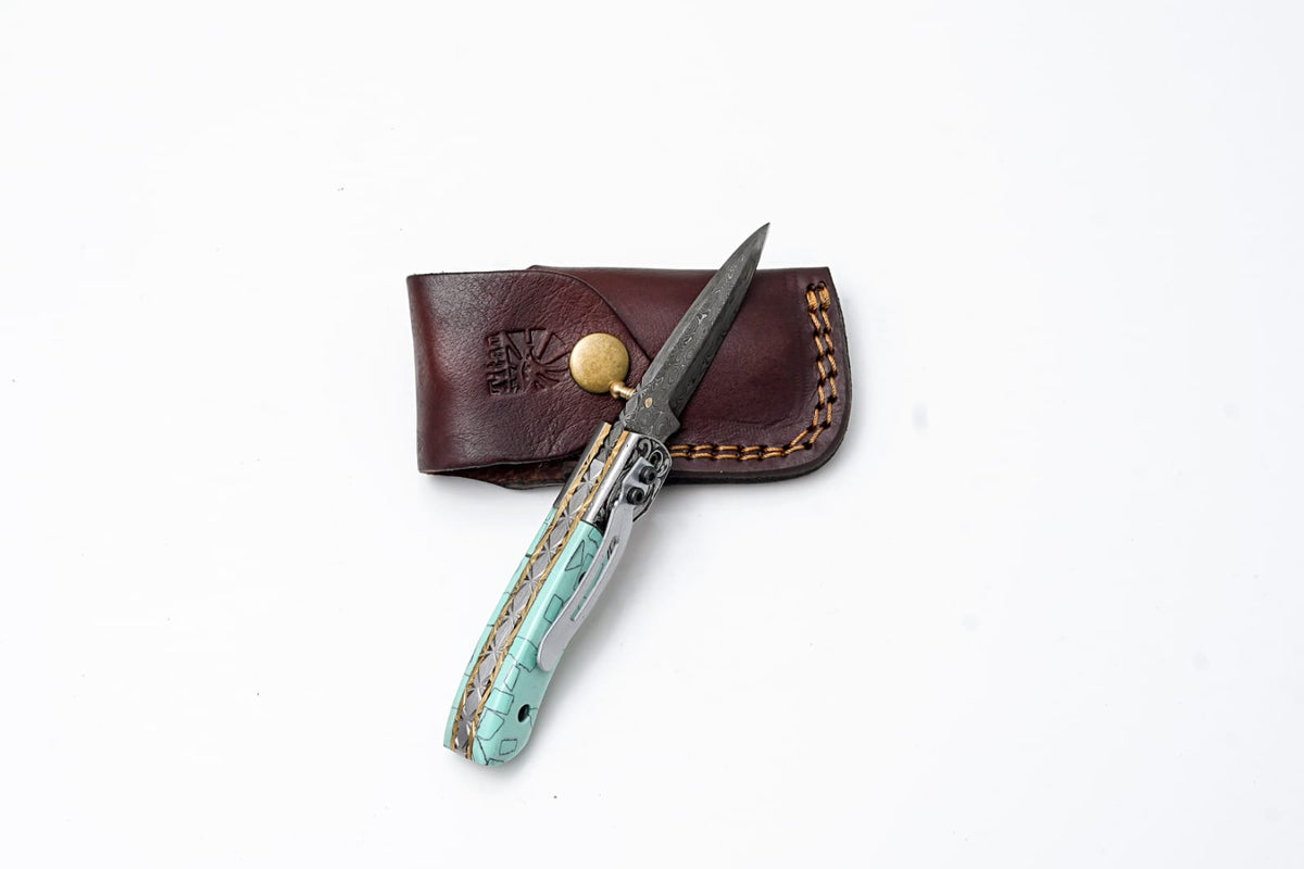 Turquoise Damascus Knife TF-090 with engraved bolster and turquoise handle in leather sheath on Tampa Home & Garden Store