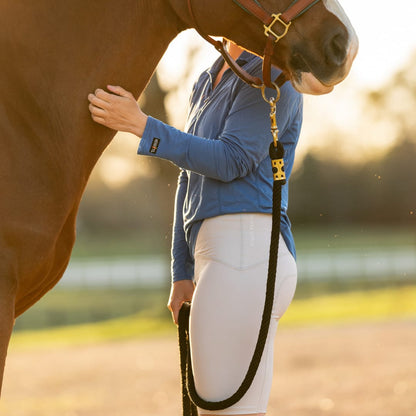 Equestrian Underwear Knee Length by Eques Pante in white worn by rider beside a horse on Tampa Home & Garden Store