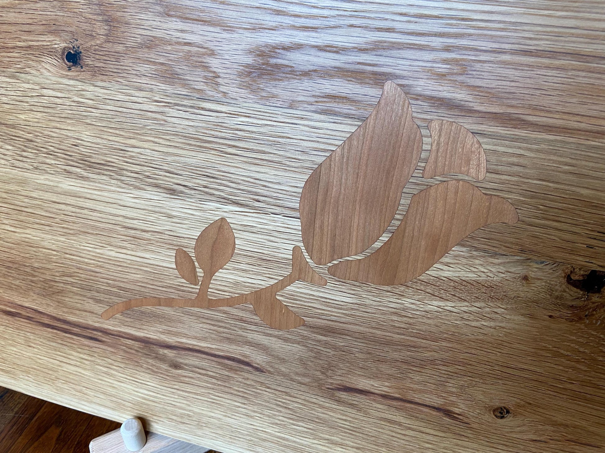 White Oak charcuterie board with subtle rose and stem inlay made from Cherry. - Tampa Home & Garden Store