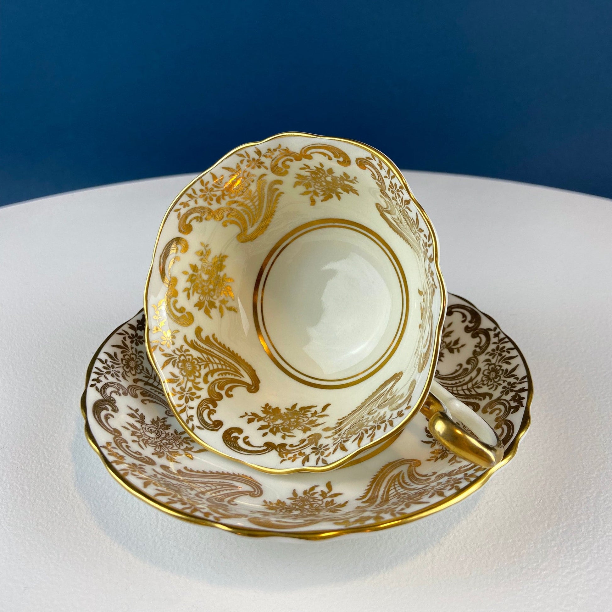 White and Gold Cup and Saucer. Paragon Porcelain, By Appointment to Her Majesty the Queen Potters. Dining Room Cabinet Display. - Tampa Home & Garden Store