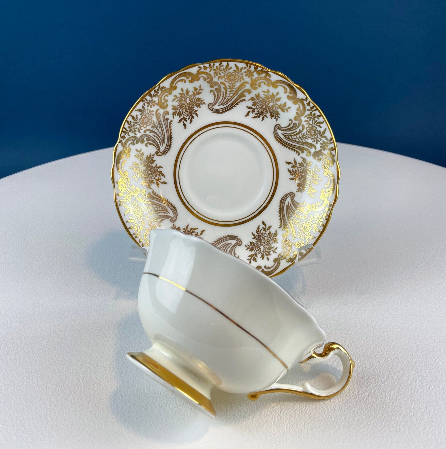 White and Gold Cup and Saucer. Paragon Porcelain, By Appointment to Her Majesty the Queen Potters. Dining Room Cabinet Display. - Tampa Home & Garden Store
