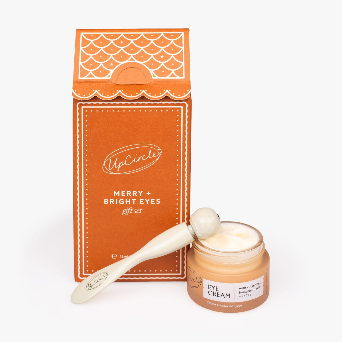 Merry + Bright Eyes Gift Set by UpCircle; orange eye cream jar with applicator on box on Tampa Home & Garden Store