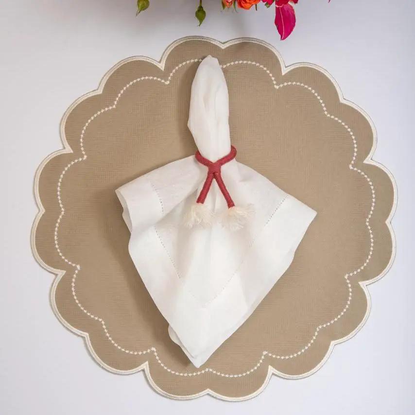 Nautical Knot Napkin Ring Holder with red rope knot on white napkin on beige scalloped placemat on Tampa Home & Garden Store