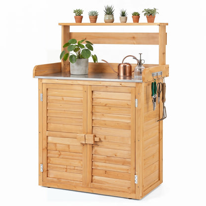 Wood potting bench with stainless steel top and storage doors; copper watering can and hooks on Tampa Home & Garden Store