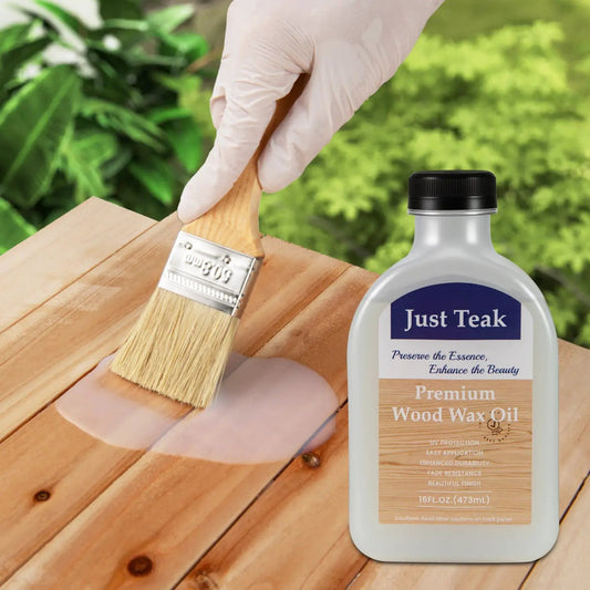 Wood Wax Oil bottle by Just Teak being brushed onto wooden boards on Tampa Home & Garden Store