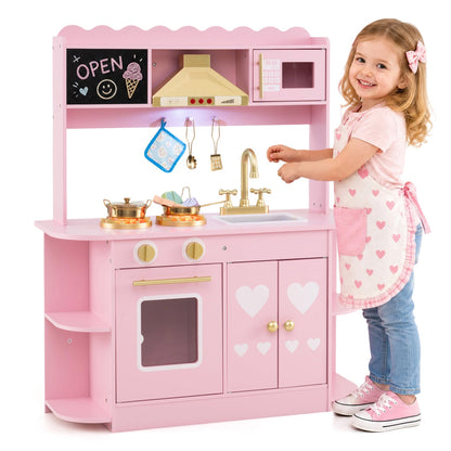 Pink wooden play kitchen set with lights and sounds, gold faucet and stove, child playing chef on Tampa Home & Garden Store