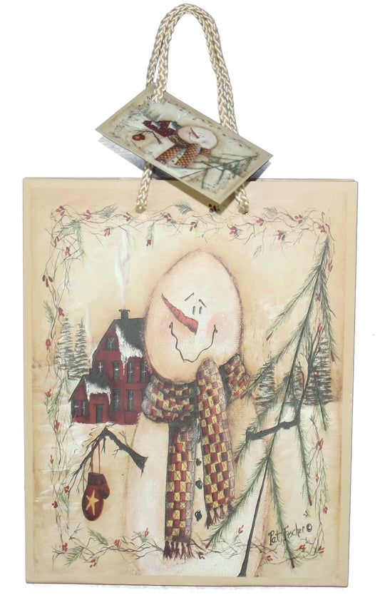 Woodland Snowman Gift Bag with braided cream handles featuring a snowman and village scene on Tampa Home & Garden Store
